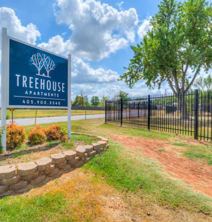 the entrance to the treehouse apartments in oklahoma at The Treehouse